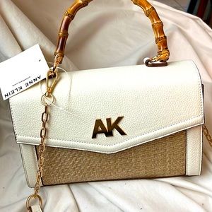 Anne Klien White w/ Nat Bamboo handle and adj strap. New never used.